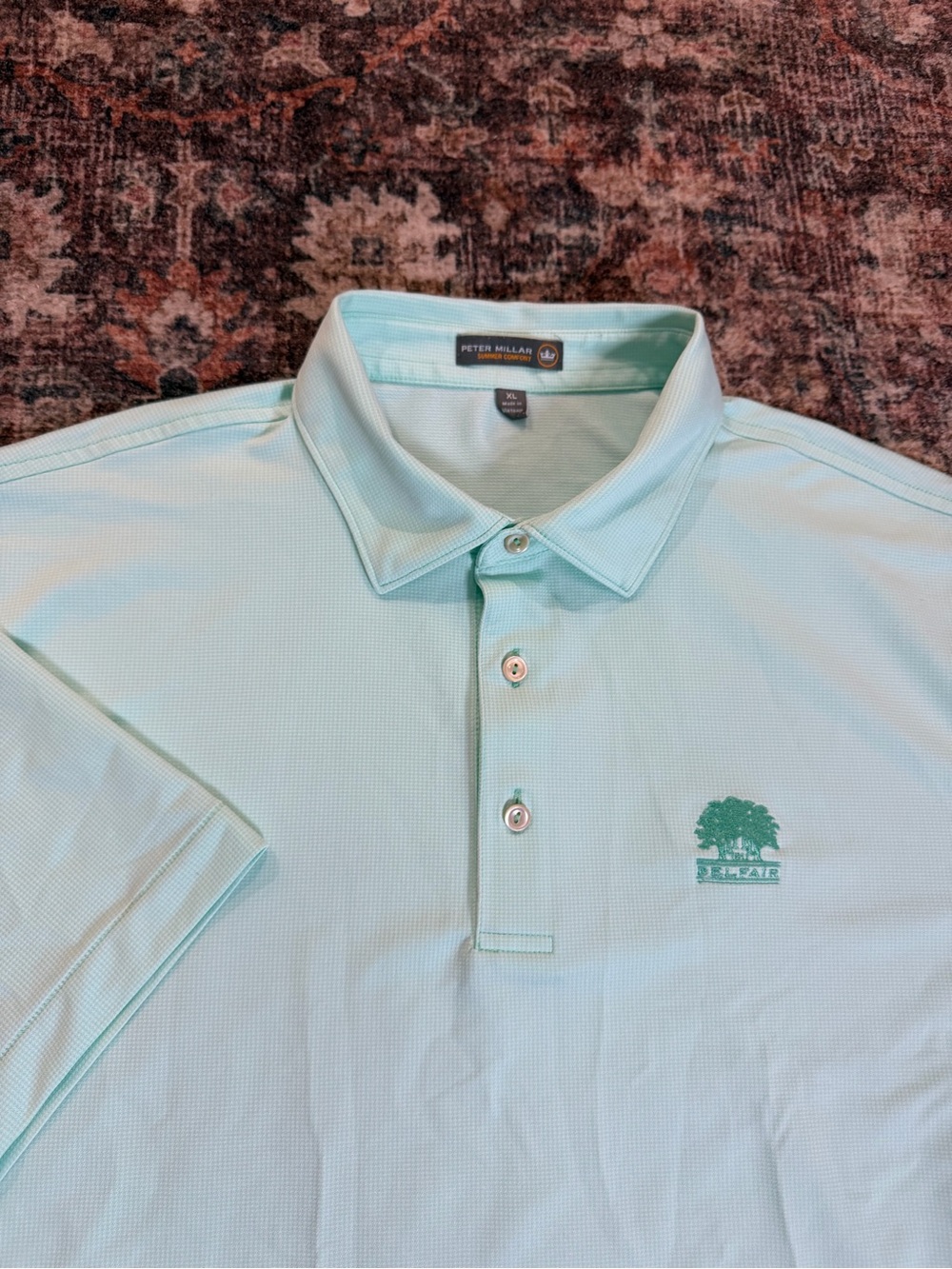 Peter Millar blue golf polo shirt Size XL with cool logo on the chest